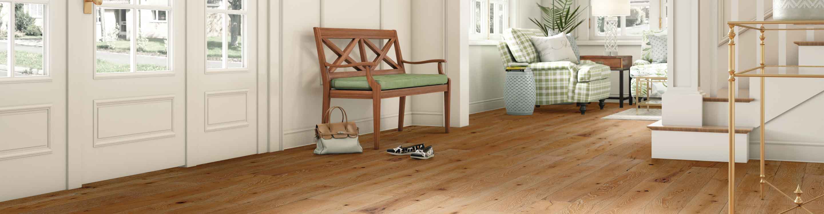 hardwood flooring in home, front door, staircase, wood chair
