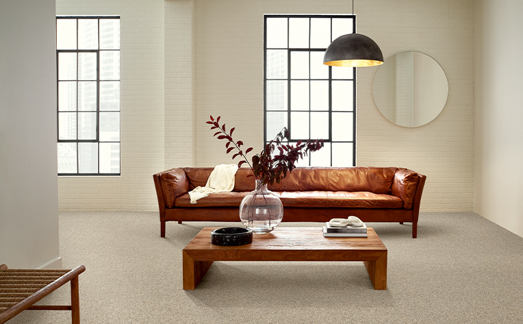 coffee table brown with white carpet and brown couch